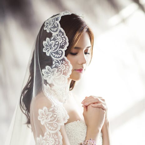 Woman in White Bridal Gown Meditating